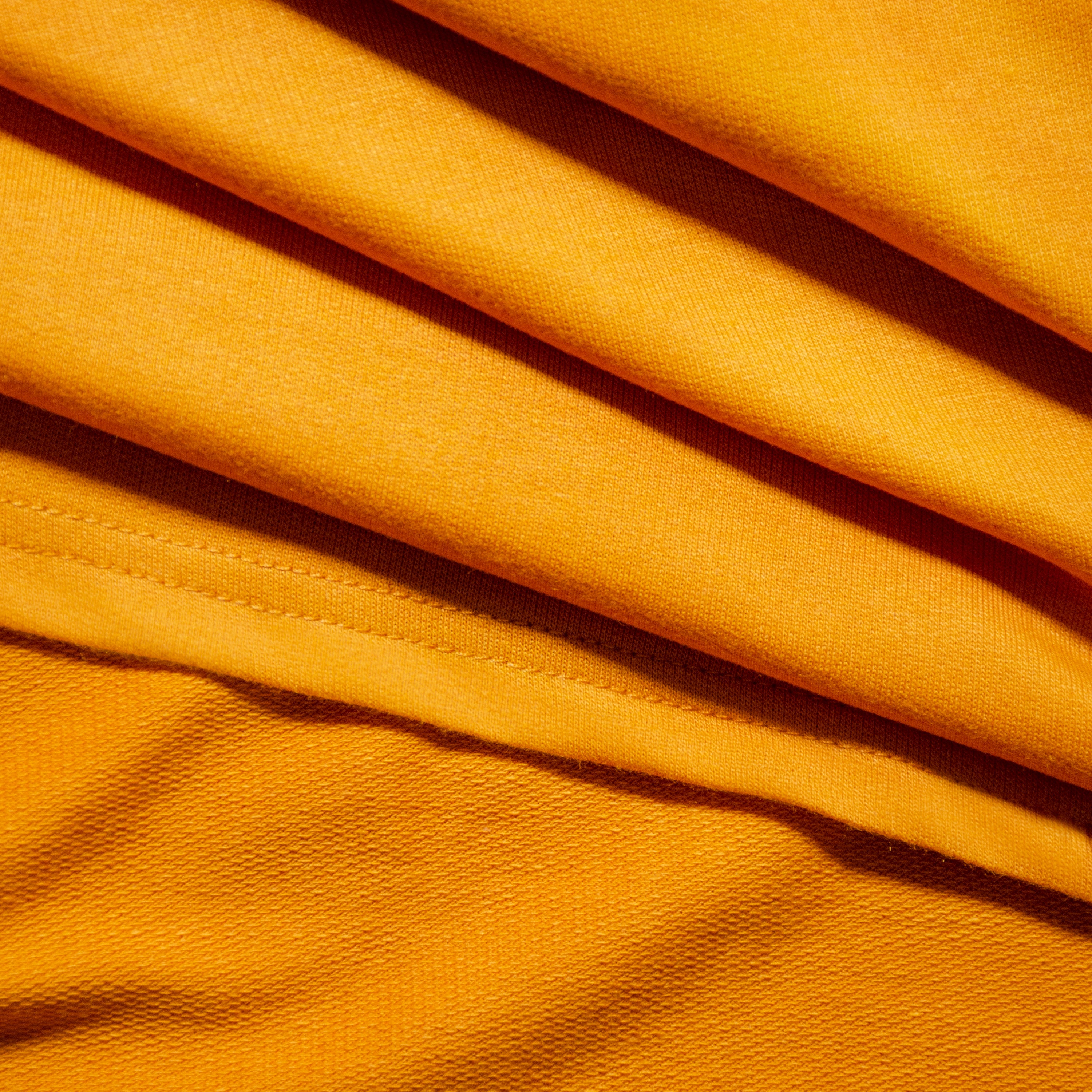 Mustard-Tshirt-Fabric-Closeup-Banner
